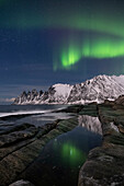 The Aurora Borealis (Northern Lights) over The Devils Jaw (Devils Teeth), Oskornan mountains, Tungeneset, Senja, Troms og Finnmark County, Norway, Scandinavia, Europe