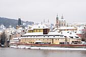 Lesser Quarter of Prague dominated by St. Nicolas Church with snow in winter, UNESCO World Heritage Site, Prague, Czech Republic (Czechia), Europe