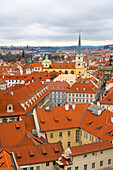 Red roofs of Lesser Quarter dominated by St. Thomas church, UNESCO World Heritage Site, Prague, Czech Republic (Czechia), Europe