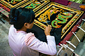 Woman embroidering ornaments at workshop, Mandalay, Myanmar (Burma), Asia