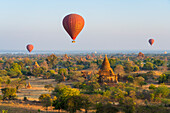 Old temples in Bagan and hot-air balloons at sunrise, Bagan (Pagan), UNESCO World Heritage Site, Myanmar (Burma), Asia