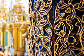 Detail of decorated column inside temple, Shwedagon Pagoda complex, Yangon, Myanmar (Burma), Asia