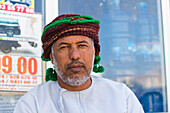 Portrait of Omani man with headwear looking at camera, Hasik, Dhofar Governorate, Oman, Middle East