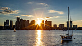 Sun flare over Boston from the East, Boston, Massachusetts, New England, United States of America, North America