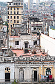 Aerial view of the dividing streets between Modern and Old Havana, with crumbling houses in foreground, Havana, Cuba, West Indies, Caribbean, Central America