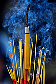 Smoking incense sticks, Ba Thien Hau Chinese Temple, Ho Chi Minh City, Vietnam, Indochina, Southeast Asia, Asia