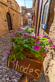 View of Rhodes sign in narrow cobbled street, Old Rhodes Town, UNESCO World Heritage Site, Rhodes, Dodecanese, Greek Islands, Greece, Europe