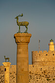View of deer statues and Saint Nicholas Fortress, Old Town of the City of Rhodes, UNESCO World Heritage Site, Rhodes, Dodecanese Islands, Greek Islands, Greece, Europe