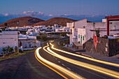 View of trail lights through Mancha Blanca, Timanfaya National Park at dusk, Mancha Blanca, Lanzarote, Las Palmas, Canary Islands, Spain, Atlantic, Europe