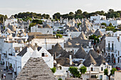 View over conical stone roofs of traditional trulli houses in the old town, Alberobello, UNESCO World Heritage Site, Puglia, Italy, Europe