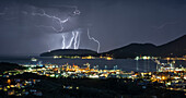 a lightning storm envelops the Gulf of Poets during an autumn evening, municipality of La Spezia, La Spezia province, Liguria district, Italy, Europe