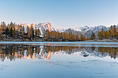 in a cold autumn dawn, the peaks of the Mont Blanc massif are reflected in Lake d'Arpy, municipality of Morgex, Aosta province, Valle d'Aosta district, Italy, Europe