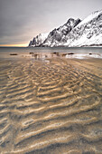 the textures of the beach with the Devil's teeth in the background, Senja, Norway, Europe