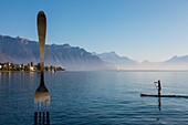 Paddler near the fork of vevey in lake geneva, sculpture by the swiss artist jean-pierre zaugg for the 10th anniversary of alimentarium, the fork, nestle museum, offbeat, lake geneva,  vevey, canton of vaud, switzerland