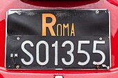 Old roman license plate on a car, automobile, traditions, typical italian shot, rome, italy