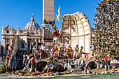 Nativity scene on saint peter's square in rome with the saint peter's basilica in the background, vatican, rome, italy