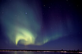 Aurora Borealis Northern Lights reflected in tundra lake near Churchill, Manitoba, sub-arctic, Northern Canada