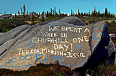 Humorous graffiti painted on rocks at Churchill, MB, Canada.