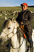 Mann auf einem Pferd in der Mongolei