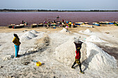 Salt collectors collecting salt to export across the region. The lake is known for its high salt content.