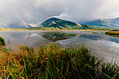 Mount Rundle and Vermillion Lakes, Banff-Jasper National Parks, Alberta, Canada. Cloudy sky with rainbow