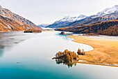 Switzerland, Canton of the Grisons, Maloja region, Sils im Engadin/Segl: Lake Sils in autumn, with Lake Silvaplana covered in mist far in the background.