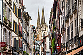 The cathedral of Bayonne in the background from the historic centre of the city. Bayonne, Nouvelle Aquitaine, France, Europe.