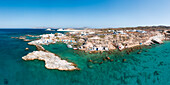 Panoramic aerial view of the small fishing village of Mandrakia and its small port (Plaka, Milos Island, Cyclades Islands, Greece, Europe)