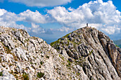 Italy, Lazio, Apennines mountain range, Hiker on top of Terminillo in Summer
