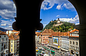 Cityscape with Schlossberg or Castle Hill mountain with old clock tower Uhrturm and Hauptplatz, from the city hall, Graz