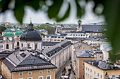 View of the Neustadt district with dome of Dreifaltigkeitskirche Holy Trinity Church, and Priesterhausgasse street, Salzburg, Austria