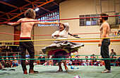 Lucha Libre. Two spontaneous up to the ring to dace with the cholita Angela la Folclorista to celebrate the victory, Sports center La Ceja, El Alto, La Paz, Bolivia