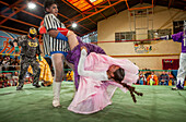 Lucha Libre. male and the cholita Celia la Simpatica wrestlers in combat, Sports center La Ceja, El Alto, La Paz, Bolivia