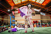 Lucha Libre. Angela la Simpatica and La Momia fighting, males and cholitas females wrestlers in combat, Sports center La Ceja, El Alto, La Paz, Bolivia