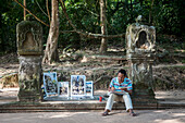 painter in the west access way to Preah Khan Temple, Angkor Archaeological Park, Siem Reap, Cambodia