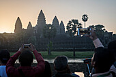 Tourists watching sunrise at Angkor Wat, Siem Reap, Cambodia