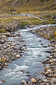 Ascencio river. Hikers walking in Torres Sector, Torres del Paine national park, Patagonia, Chile