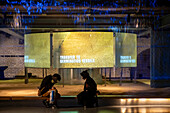 Visitors sniffing and watching the barley. Exhibit about the barley grain used to make Guinness Draught beer inside the Guinness Storehouse, brewery, museum, exhibition, Dublin, Ireland