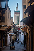 Talaa Kebira street, and minaret of Chrabliyine Mosque. Fez. Morocco