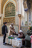 Customers and incense and henna saleswomen, Zaouia (tomb) of Moulay Idriss II, medina, Fez. Morocco