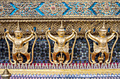 Gold Kinnara statues, Temple of the emerald Buddha, Wat Phra Kaeo temple, Grand Palace, Bangkok, Thailand