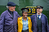 Tourist and workers, firemen, Llanfair and Welshpool Steam Railway, Wales