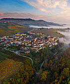Aerial view of Falletti Castle, Barolo and La Morra in the distance at sunrise during autumn, Cuneo, Langhe e Roero, Piedmont, Italy, Southern Europe