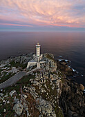 Aerial view of Punta Nariga lighthouse at sunrise, Costa da Morte, Galicia, Spain, Iberian Peninsula, Western Europe