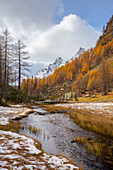 Autumnal view of the Lago delle Streghe lake at Crampiolo, Alpe Devero. Alpe Devero, Devero valley, Antigorio valley, Ossola valley, Piedmont, Verbano Cusio Ossola district, Italy.