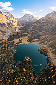 Aerial view of Cavloc Lake in autumn. Maloja Pass, Val Forno, Canton of Grisons, Engadin, Switzerland.