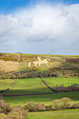 View of the limestone figure called Osmington White Horse on a hill near Weymouth. Dorset, England, United Kingdom.