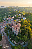 Aerial view of a summer sunset over the Cigognola castle. Cigognola, Oltrepo Pavese, Pavia district, Lombardy, Italy.