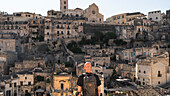 A young man is admiring the beautiful city of Matera. Matera, Basilicata, Italy, Europe