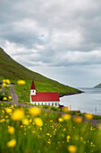 Europe, Denmark, Faroe Islands, Kunoy: a classic little church on the coastline